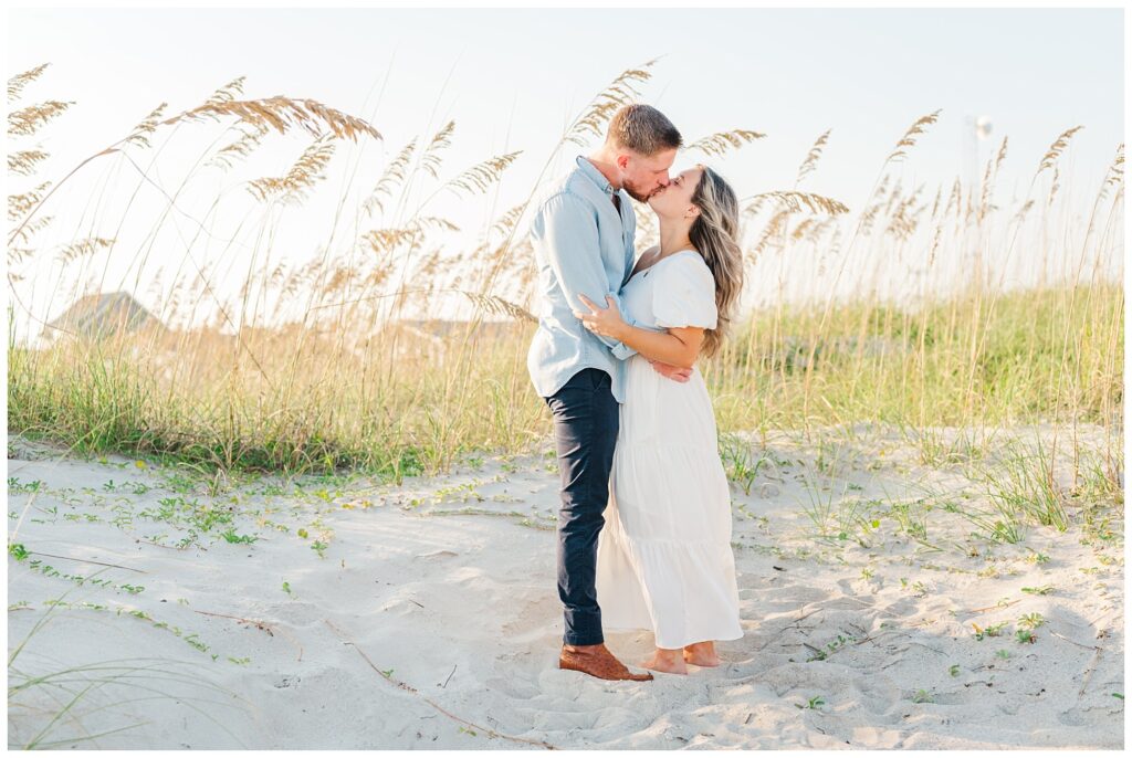 couple kissing on the beach at Oak Island, NC