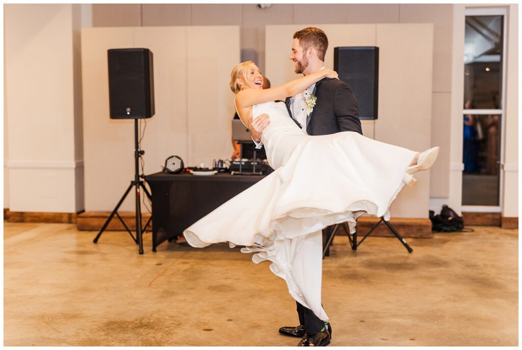 bride and groom spinning around the dance floor at The Meadows Raleigh reception