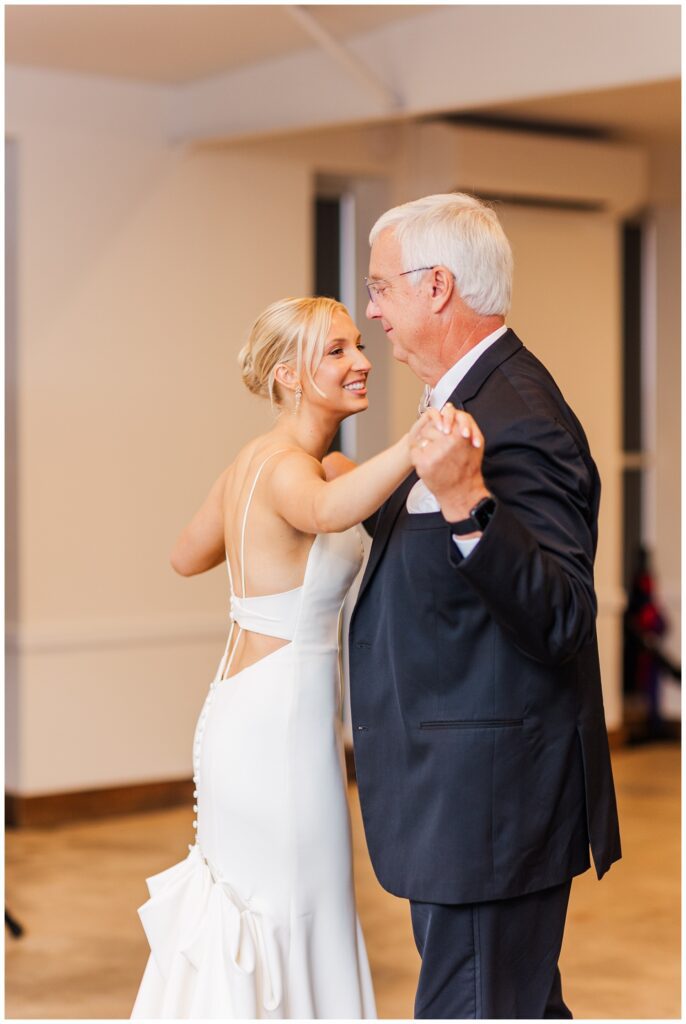 bride shares dance with her dad during fall reception in Raleigh, NC
