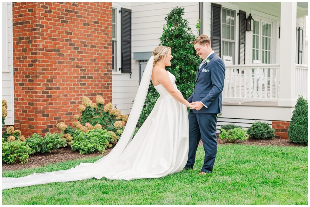 bride and groom's first look outside the front of the house at The Barn at Mattiponi Springs