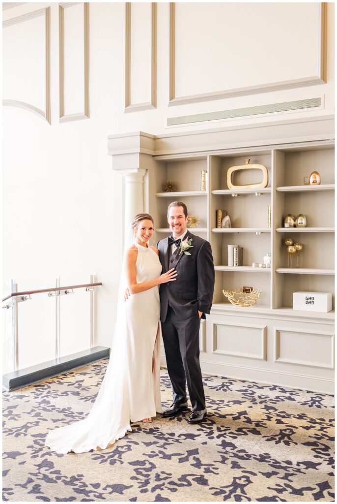 bride and groom posing after first look at Raleigh NC venue downtown
