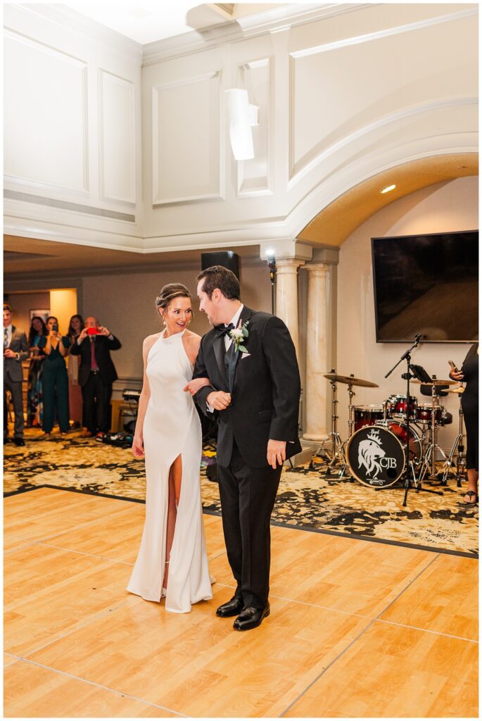 bride and groom walking onto dance floor at fall wedding in Raleigh