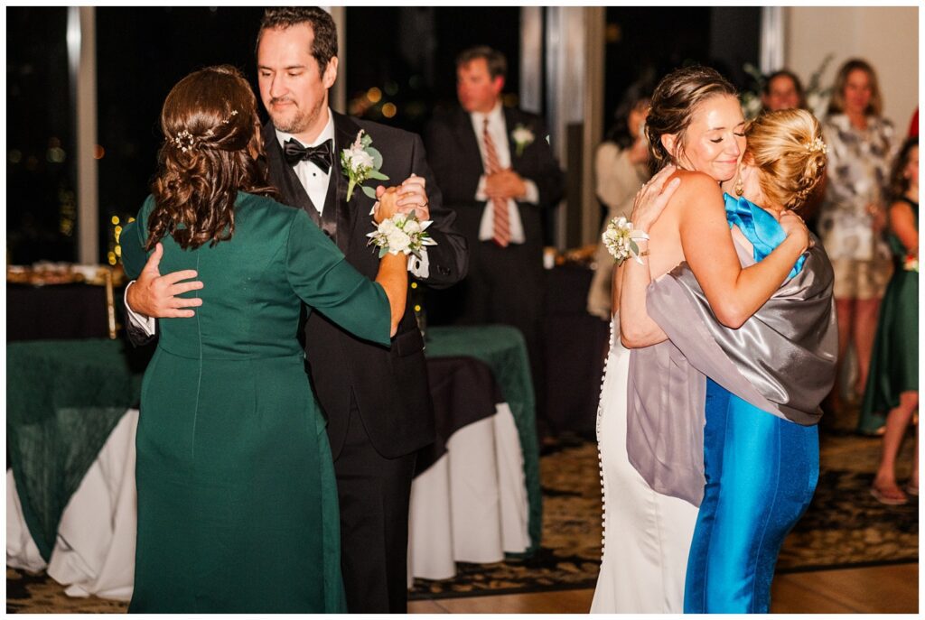 bride and her mom and groom and his mom having first dances at City Club Raleigh