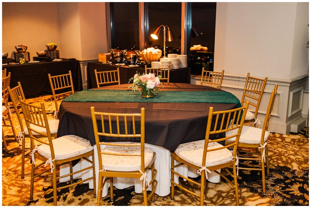 reception tables decorated with green table runners and florals at City Club Raleigh