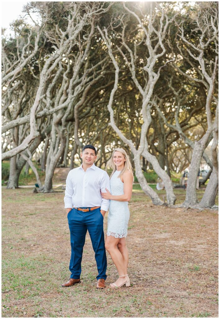 Fort Fisher engagement photographer standing near the trees in NC