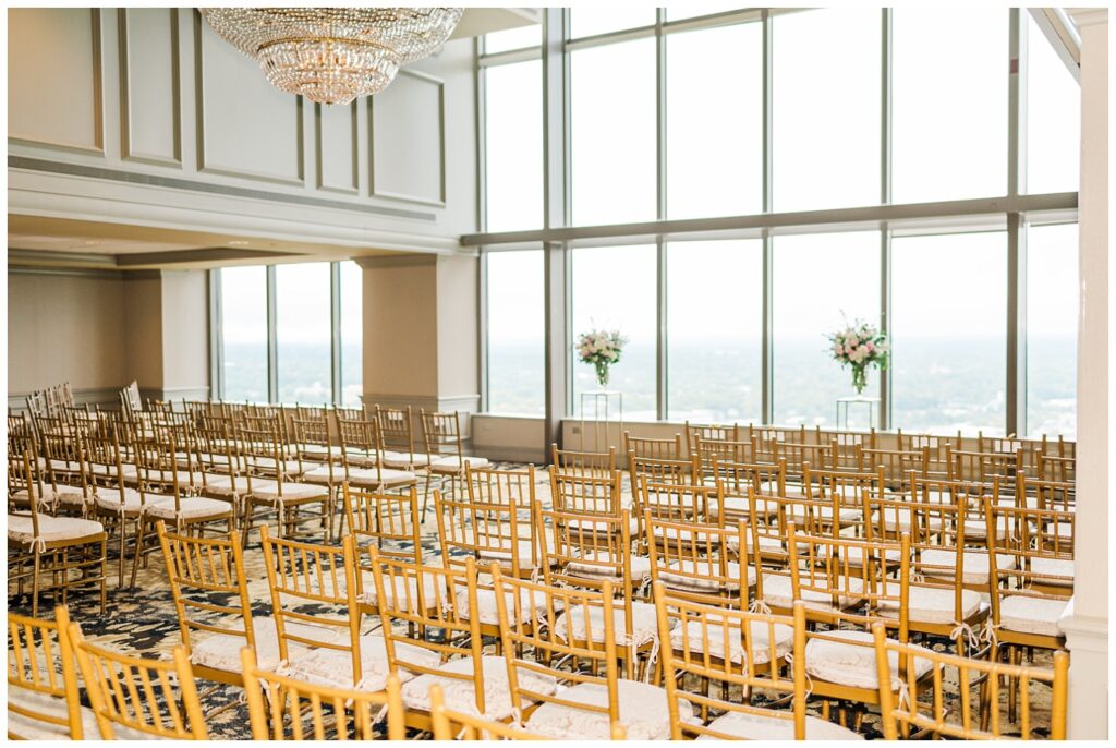 wedding ceremony set up of gold chairs at the City Club Raleigh downtown