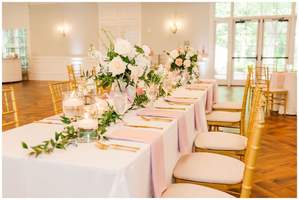 reception tables with white and pink floral centerpieces at Wilmington wedding venue