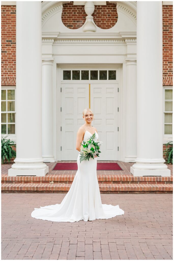 bride posing with a bouquet at Meredith College bridal session