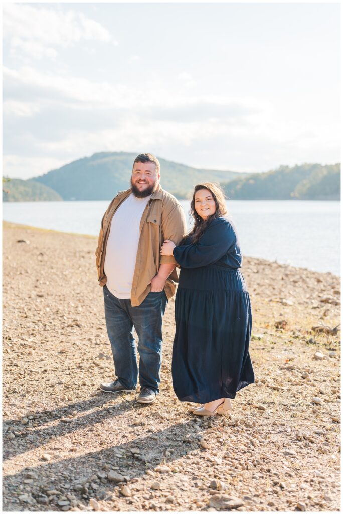 engaged couple posing near the lake at Carvins Cove Natural Reserve