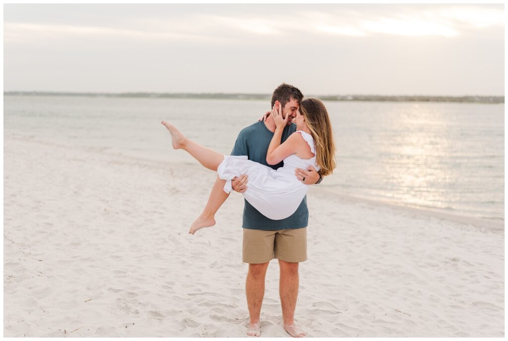 sunset engagement session on the sand at Wrightsville Beach, NC