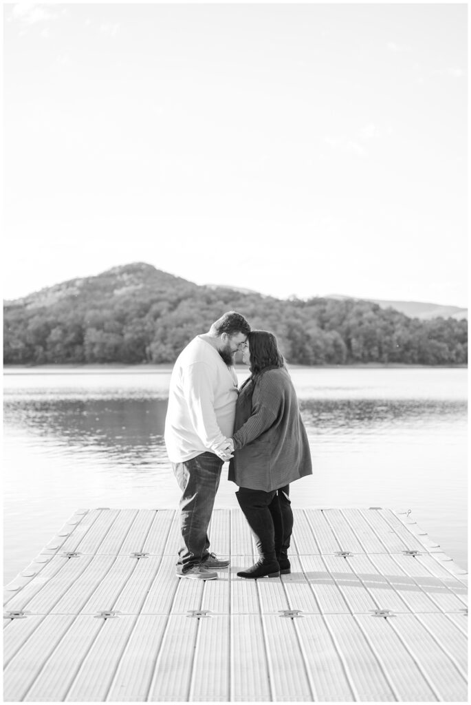 couple standing on the dock at the lake in Carvins Cove, VA
