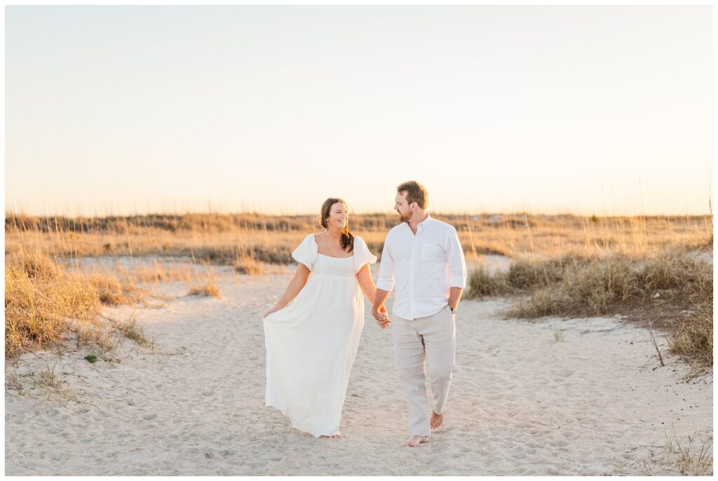 couple walking together during golden hour at Wrightsville Beach session