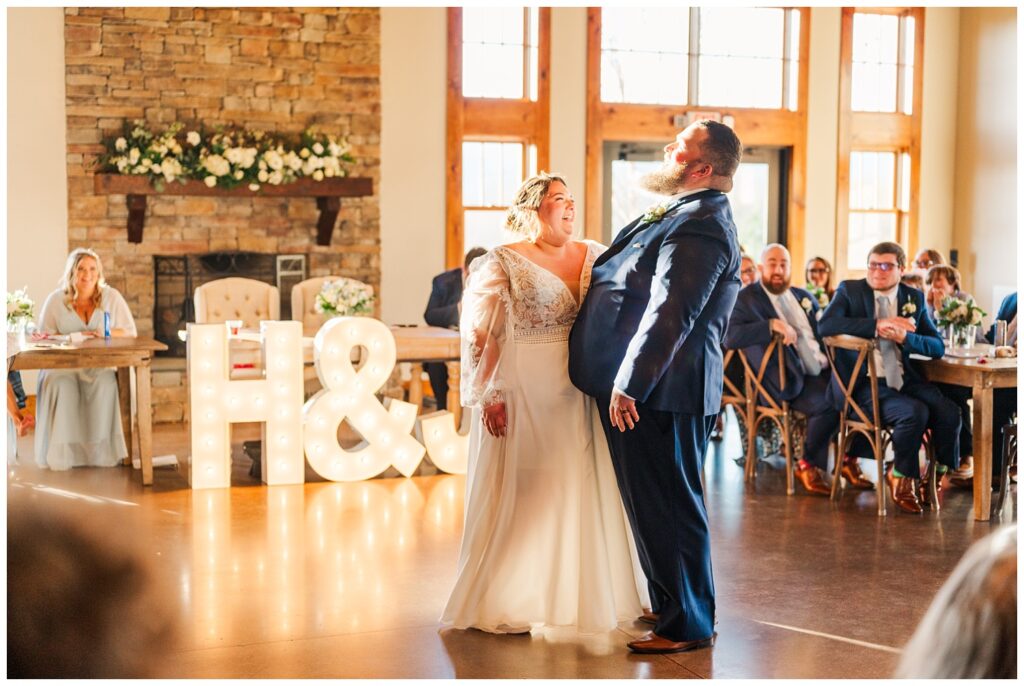 bride and groom have first dance at reception hall at Virginia wedding venue