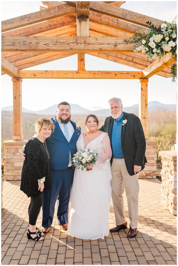 family formals with bride and groom outside at the Glass Hill Venue