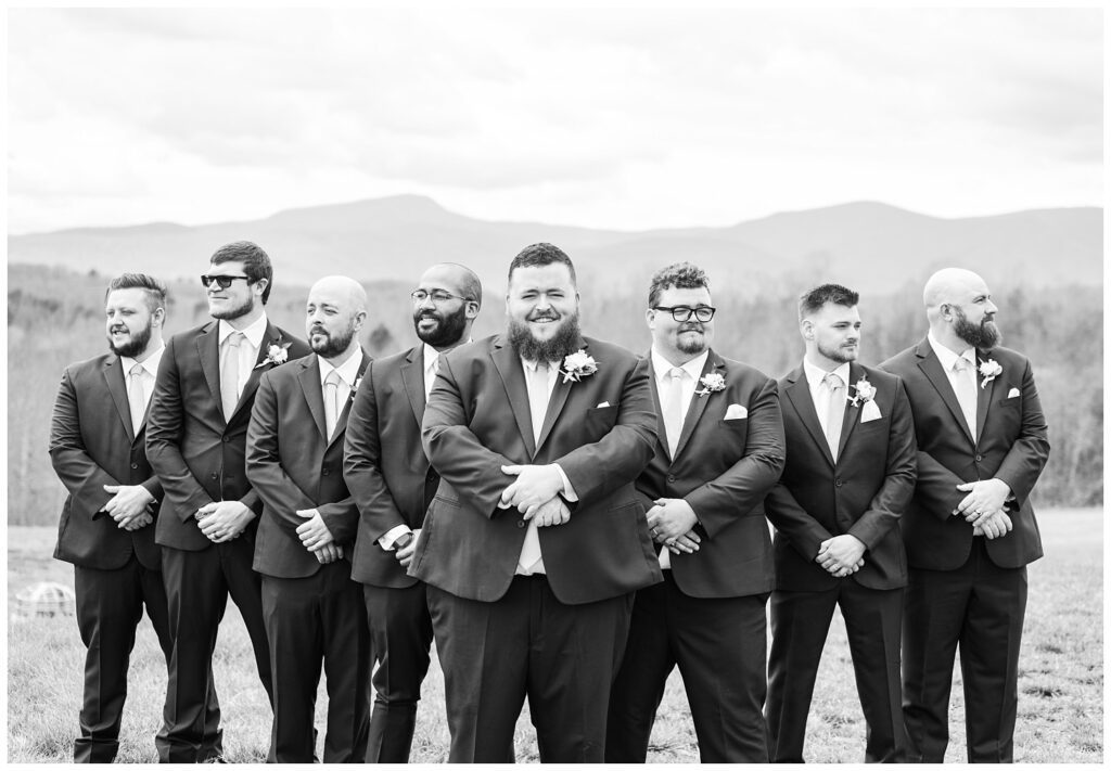 groomsmen posing with the mountains in the background in Virginia 