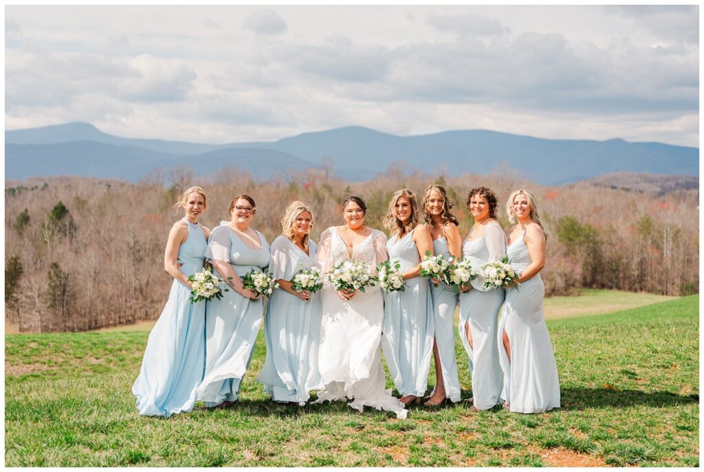 bridal party posing with the bride at Virginia mountains wedding venue