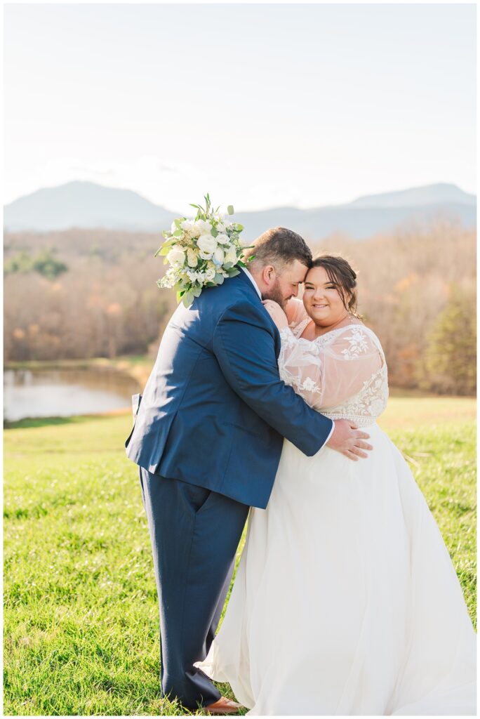 bride has bouquet wrapped around the groom's neck and smiling 