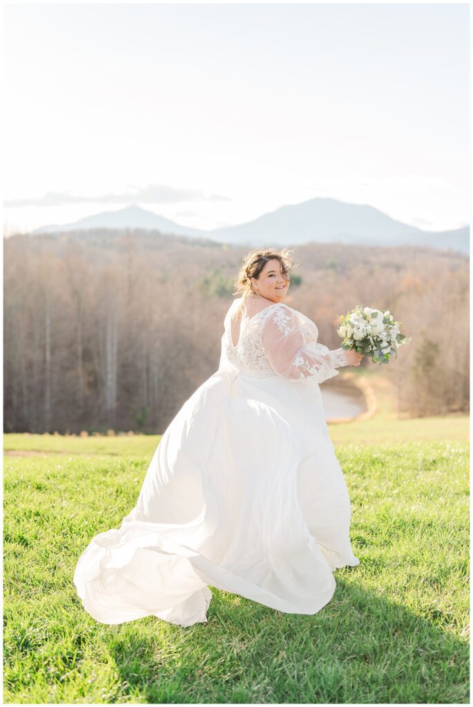 wind blowing the bride's lace dress at the Glass Hill Venue in Virginia 