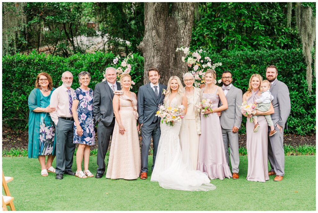 pre-ceremony family portraits at Wrightsville Manor outside at the altar 