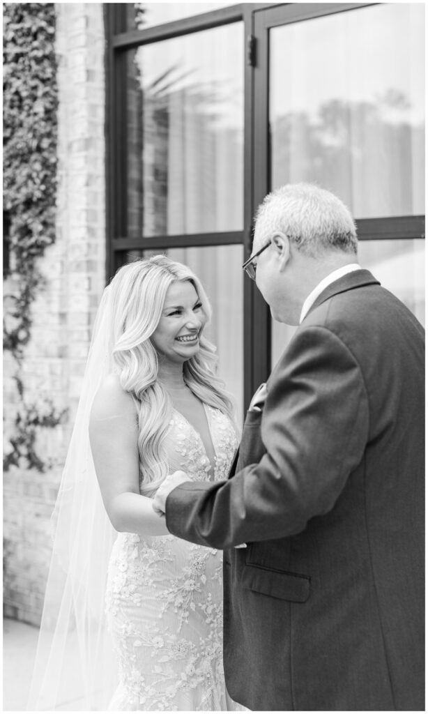 bride having a first look with her dad outside the wedding venue in Virginia