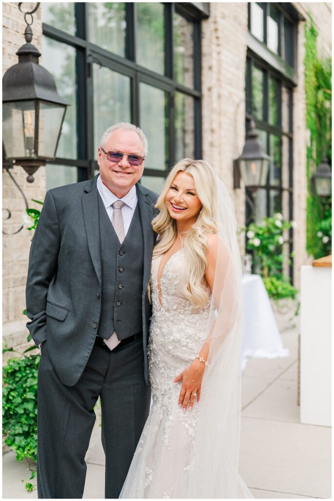 bride having a first look with her dad outside the wedding venue in Wilmington