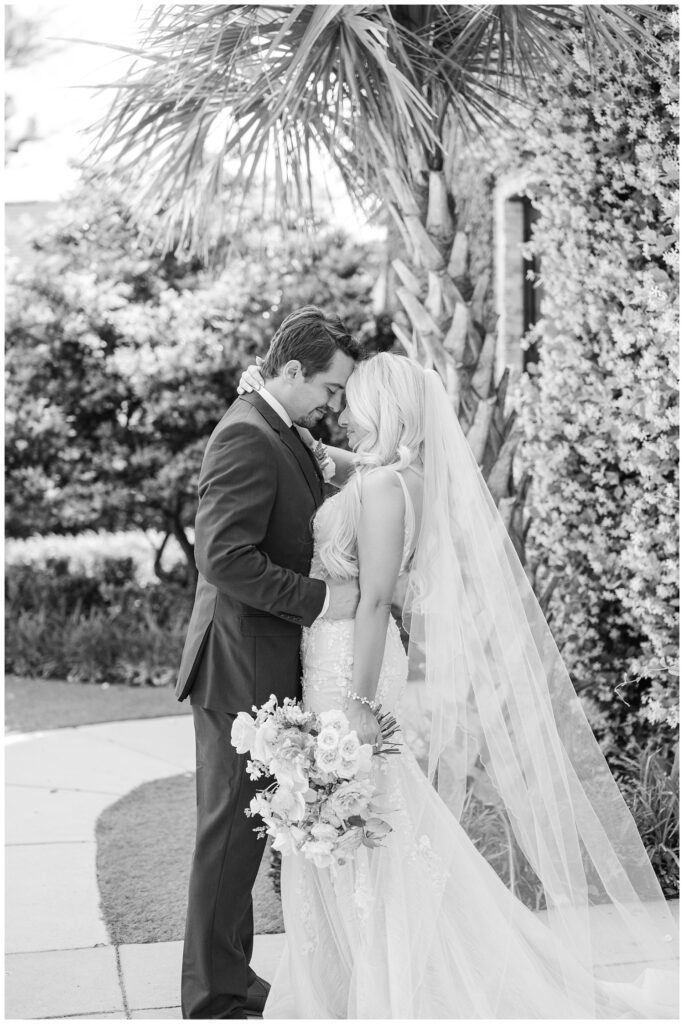 wedding couple posing together during  first look in Wilimgton