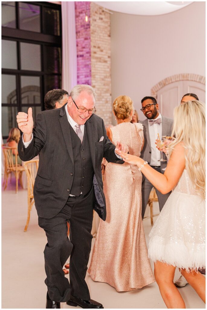 bride dancing with her dad during the reception at Wilmington wedding venue