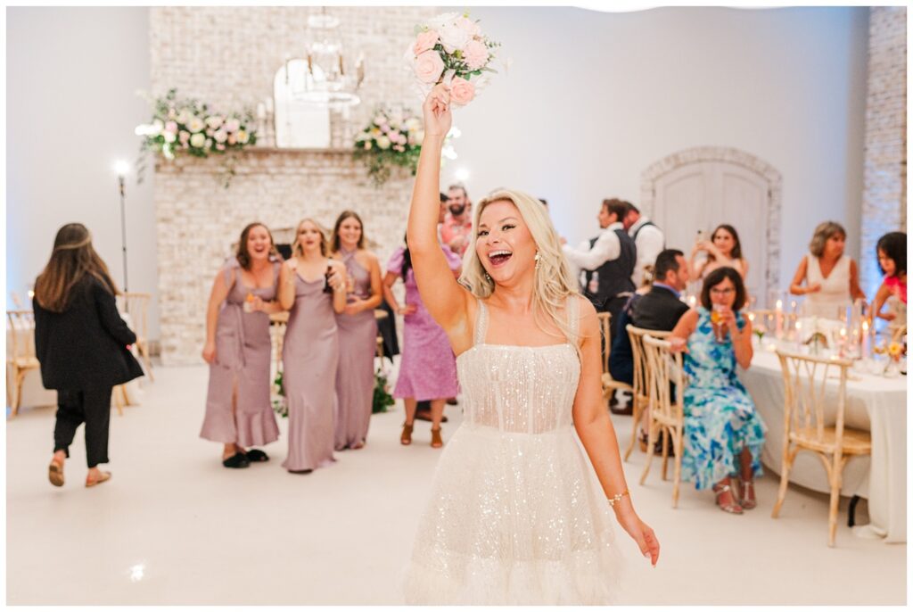 bride tossing the bouquet during wedding reception in Wilmington