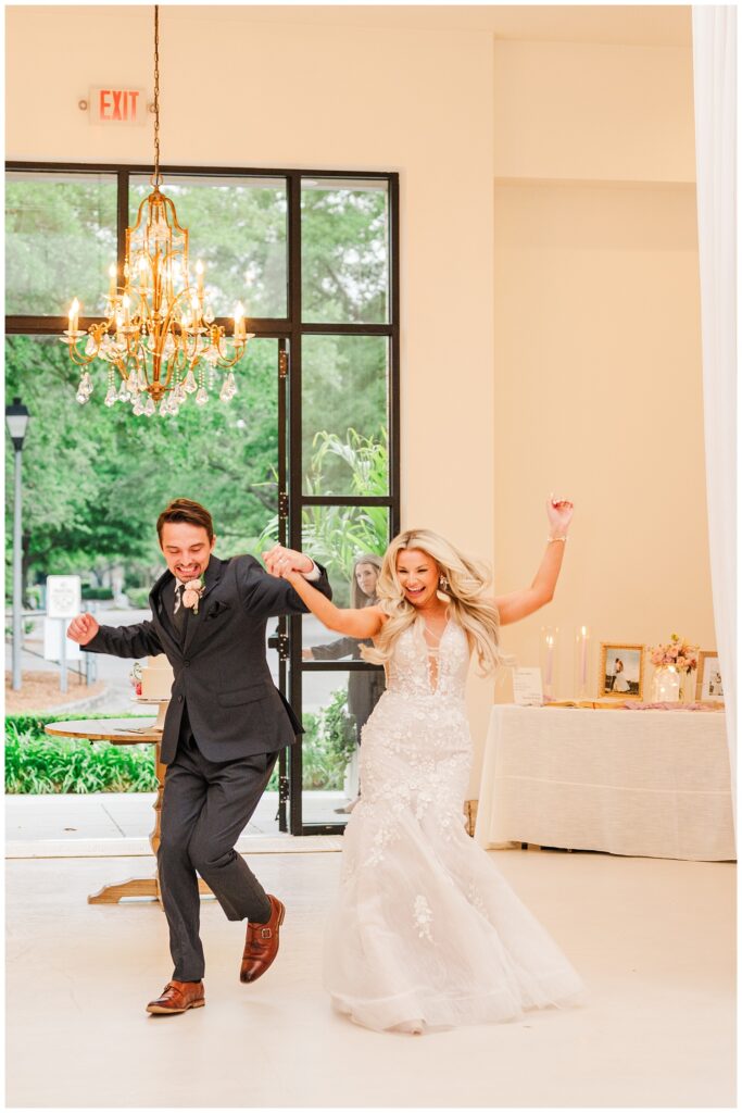 bride and groom making their grand entrance into the reception in Wilmington