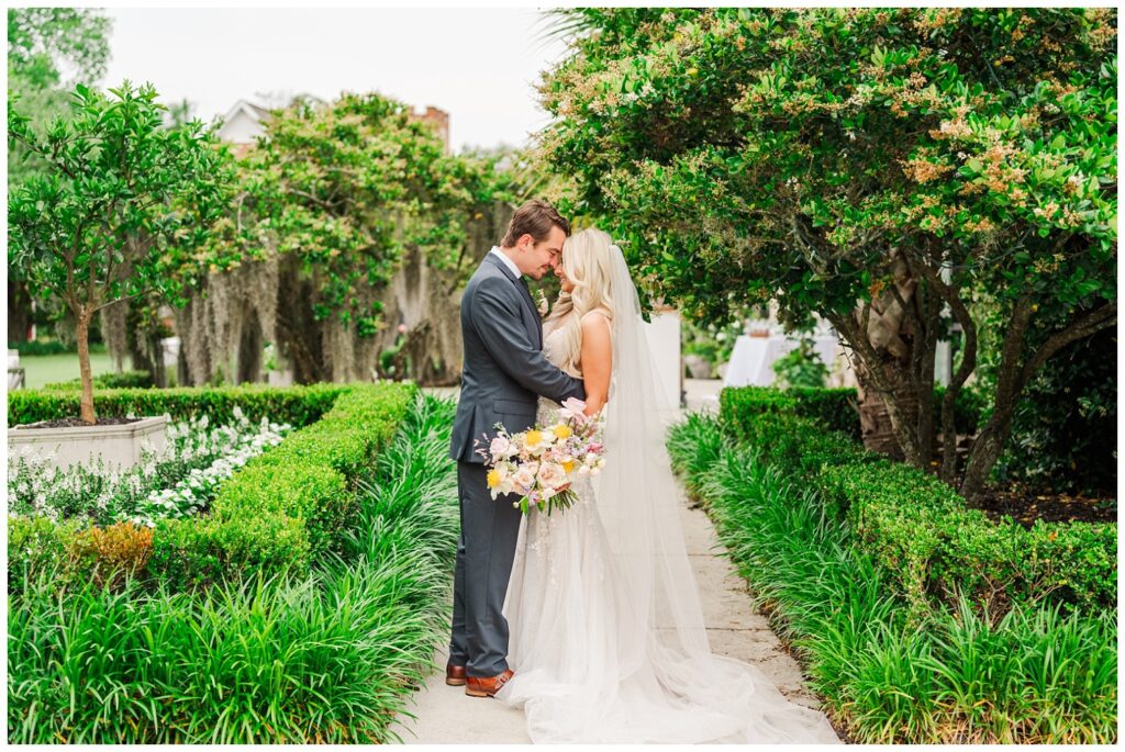 couple touching foreheads during pre-ceremony at Wrightsville Manor 