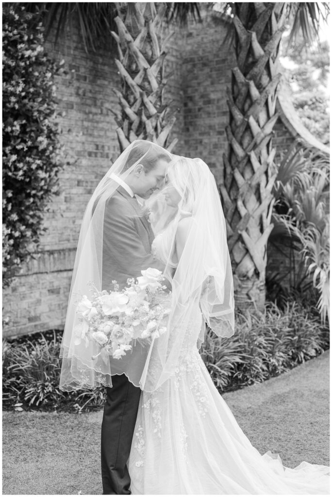 bride's veil on top of the bride and groom at spring Wilmington wedding