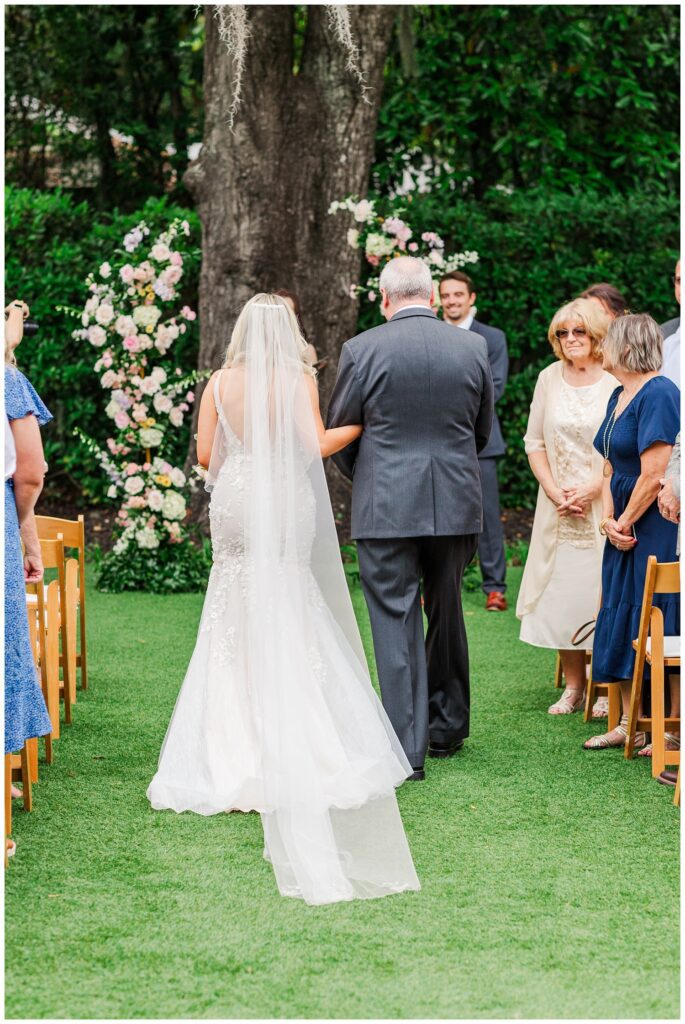 bride and her dad walking down the aisle at Wilmington wedding ceremony