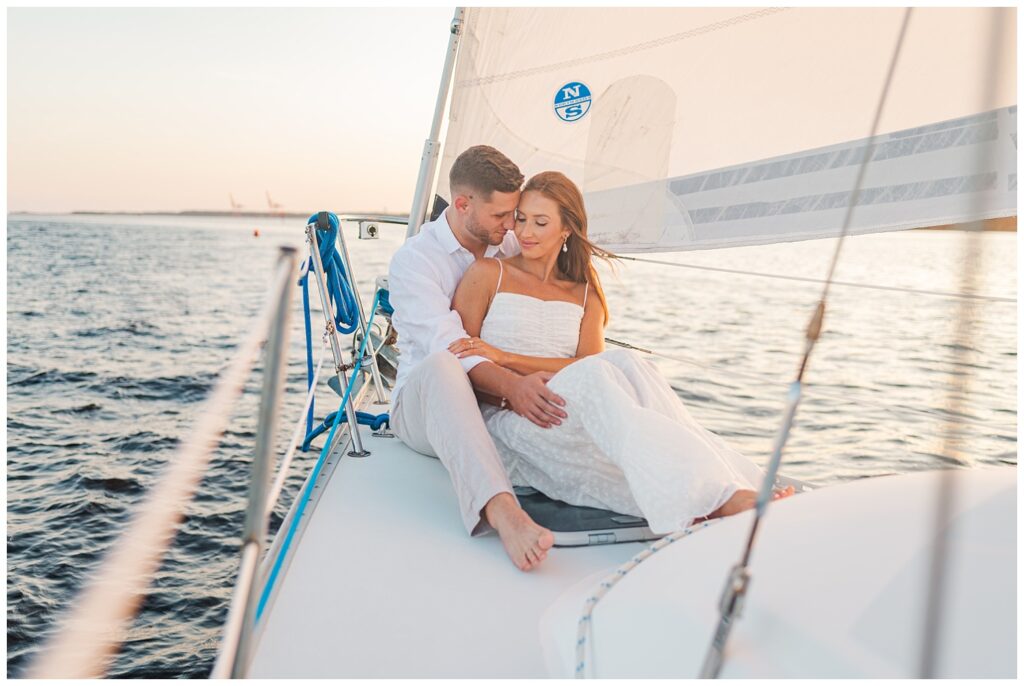 Wilmington engagement photographer on a sailboat on the water