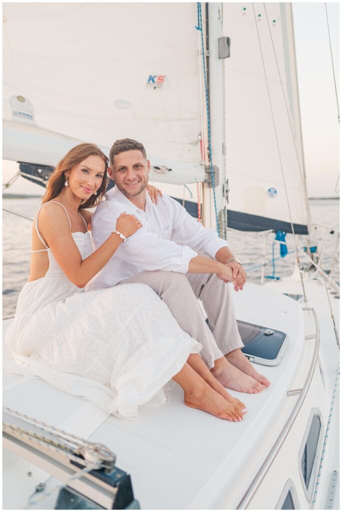 couple sitting next to each other on a boat on the water in Carolina Beach