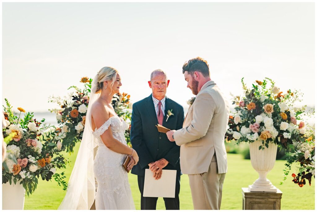 bride and groom reading their own vows at outdoor ceremony in Hilton Head