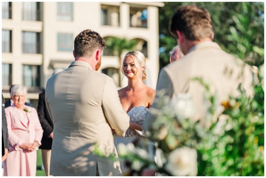 groom reading his own vows at outdoor ceremony in Hilton Head, SC