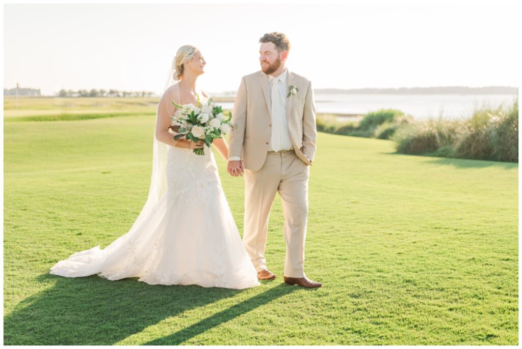 groom and bride portraits on the golf course after outdoor ceremony in Hilton Head