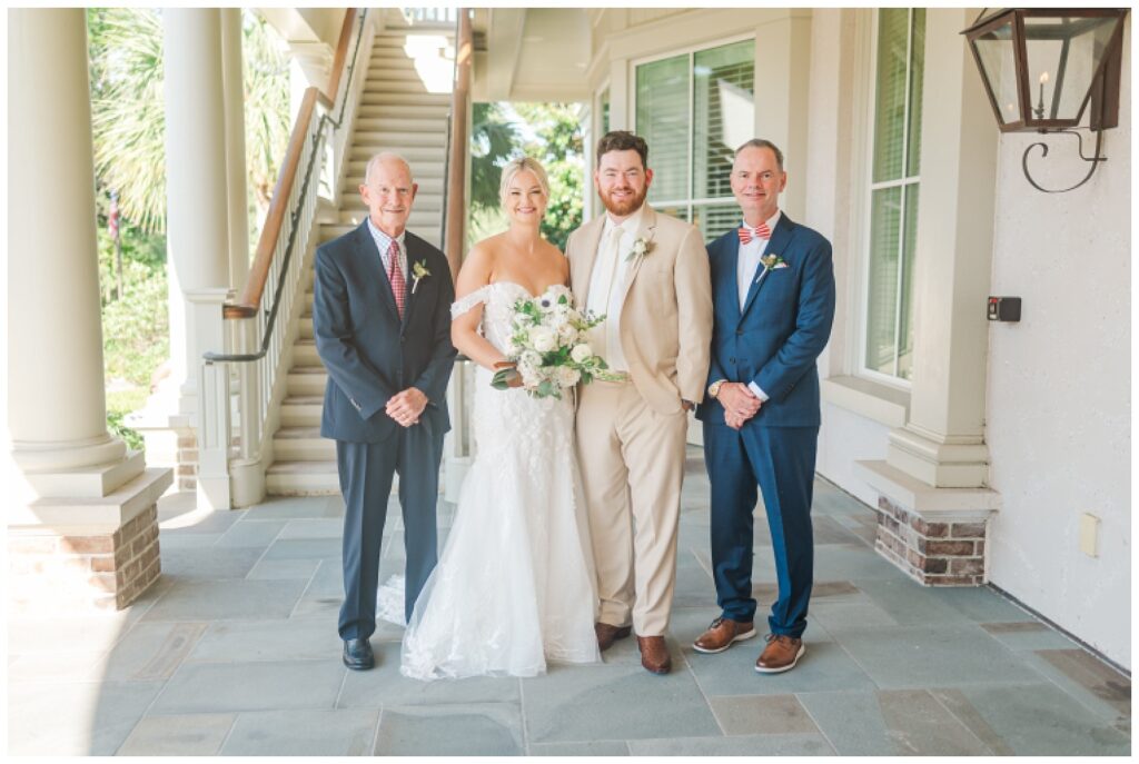 family portraits under the balcony at Sea Pines Resort wedding venue