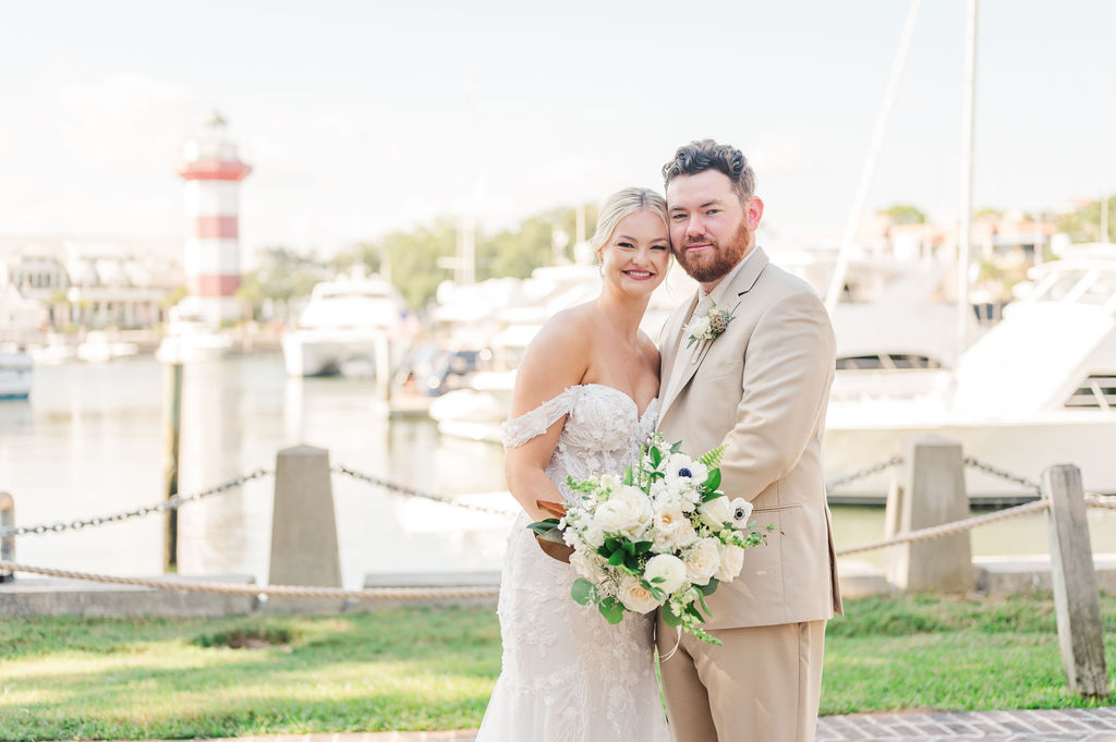 wedding couple posing near the water at Sea Pines Resort