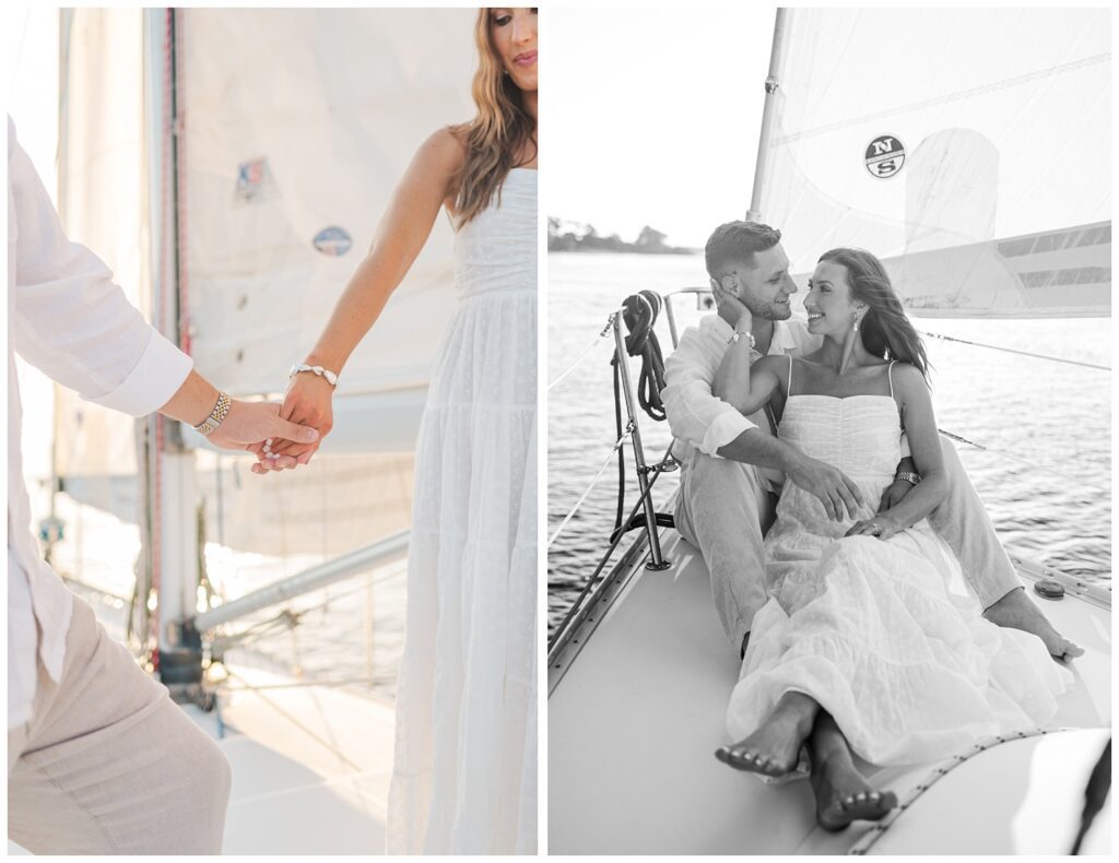 couple holding hands and standing on a sailboat in the water