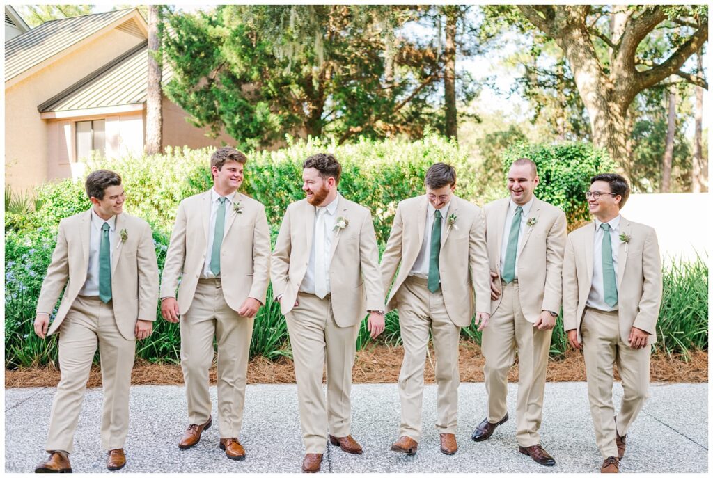 groomsmen walking together and laughing at Sea Pines Resort wedding venue