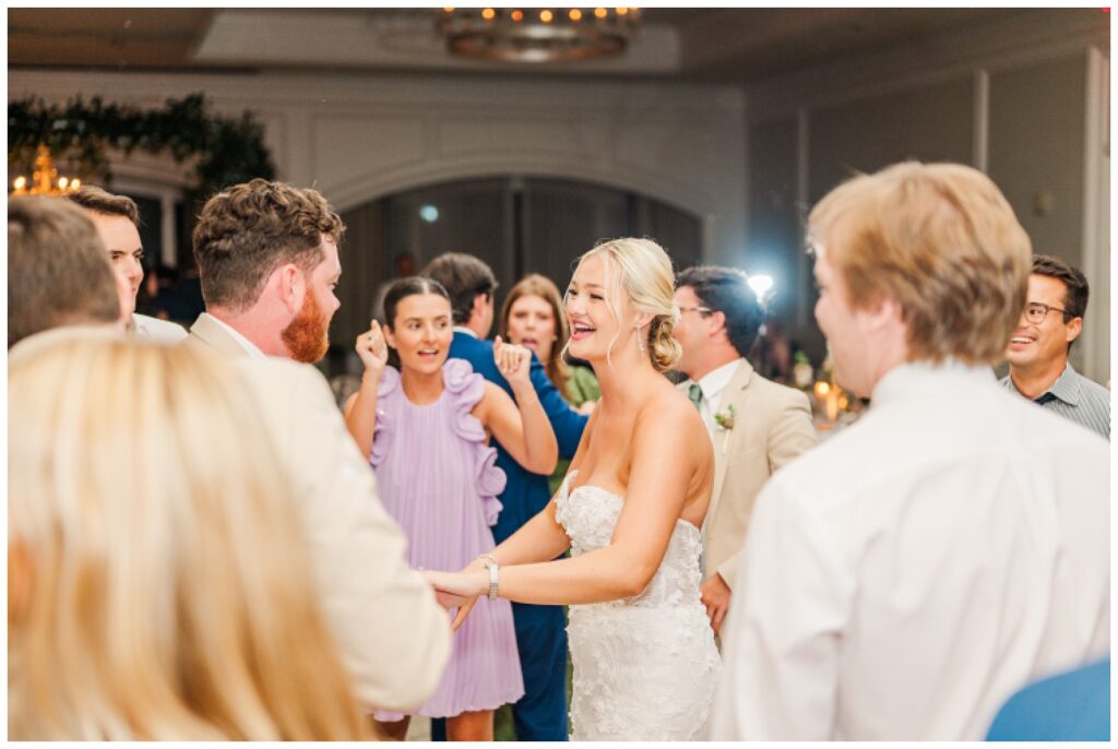 bride and groom joining the guests dancing at wedding reception at Sea Pines Resort