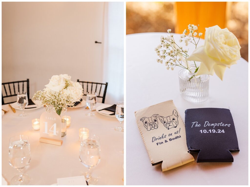 wedding koozies on a white table with a vase of babies breath and a white rose