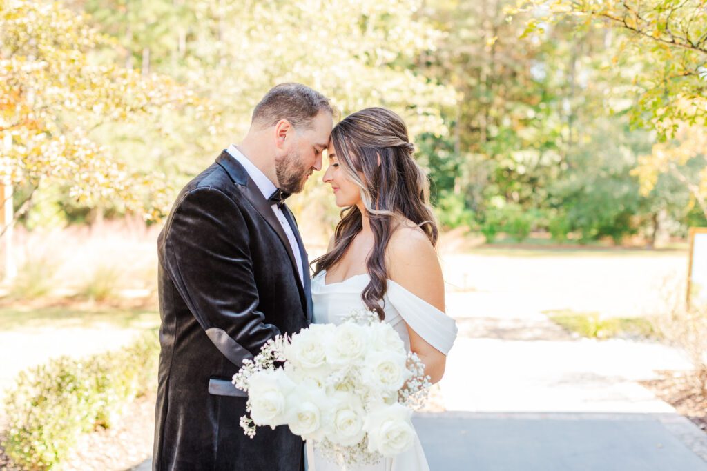 wedding couple touching foreheads at Malachi Meadows venue in NC