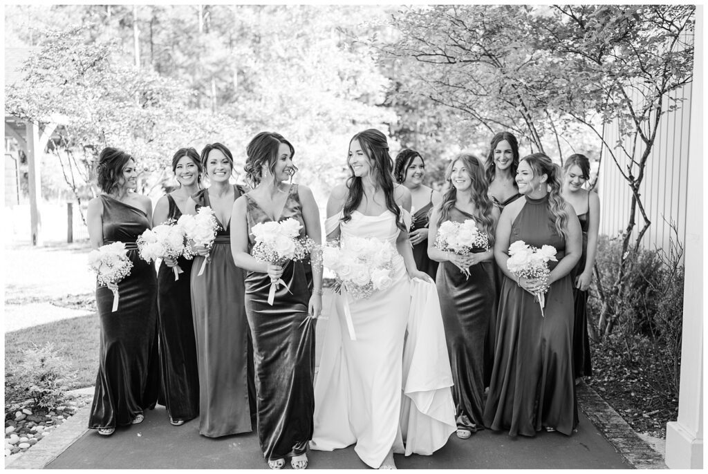 bridal party walking on the patio together laughing and smiling