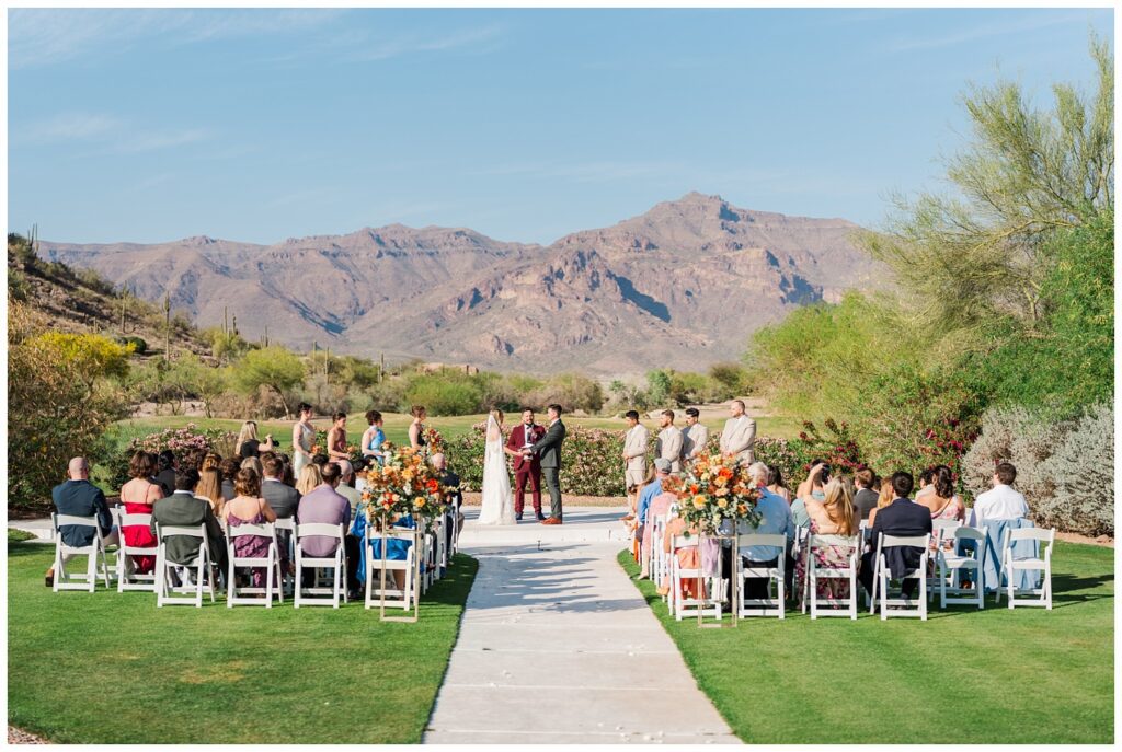 wide shot of the wedding ceremony against the backdrop of Arizona mountains