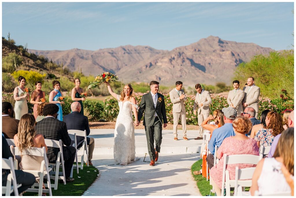 wedding couple walking back down the aisle after getting married at the Gold Canyon Golf Resort in Arizona