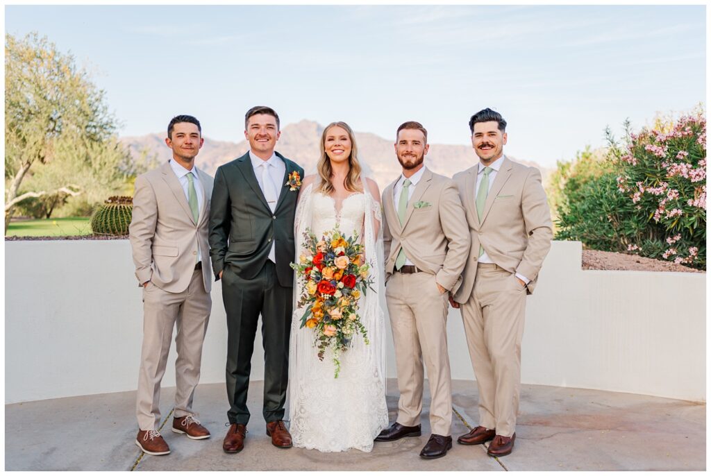 bride and groom posing with family after the outdoor ceremony in Arizona
