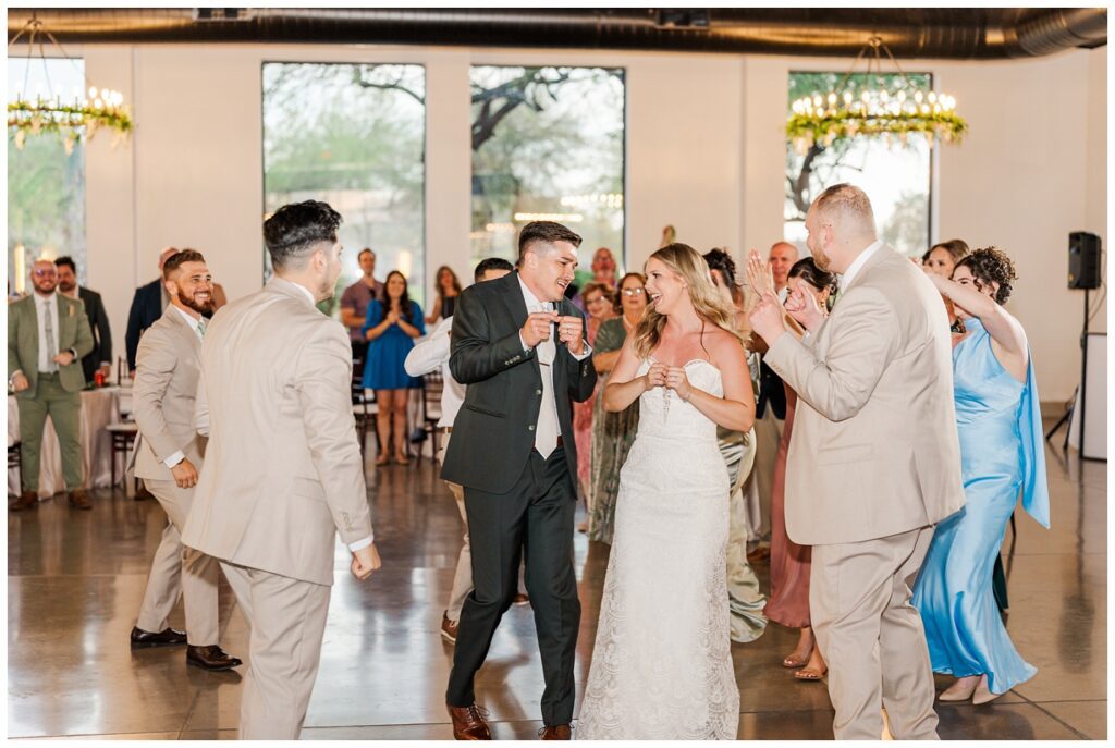 wedding couple dancing with the bridal party after making their entrance into the reception