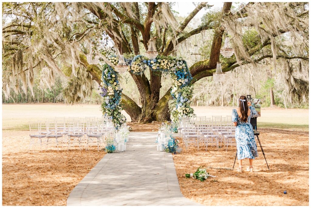 live wedding painter creating a canvas at Bluffton, SC styled shoot wedding
